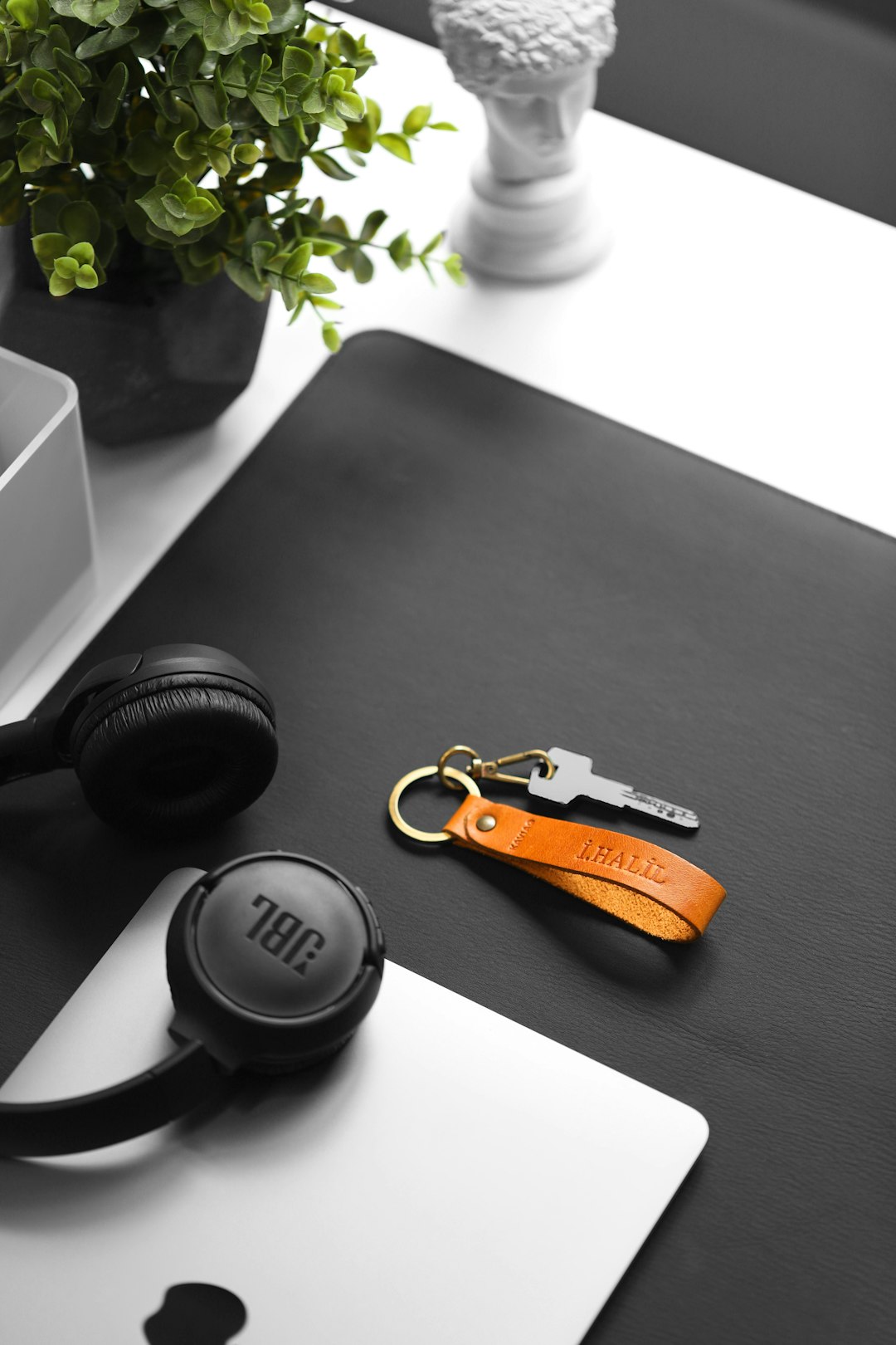 a-pair-of-headphones-sitting-on-top-of-a-laptop-4nwguvtz6wy